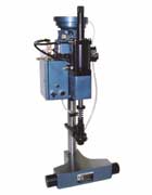 Automatic pin inserter with pin chuck, dual palm buttons and vibratory feeder bowl.